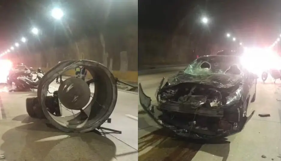 Ventilador de teto do rodoanel no chão e um carro destruído após o ventilador cair